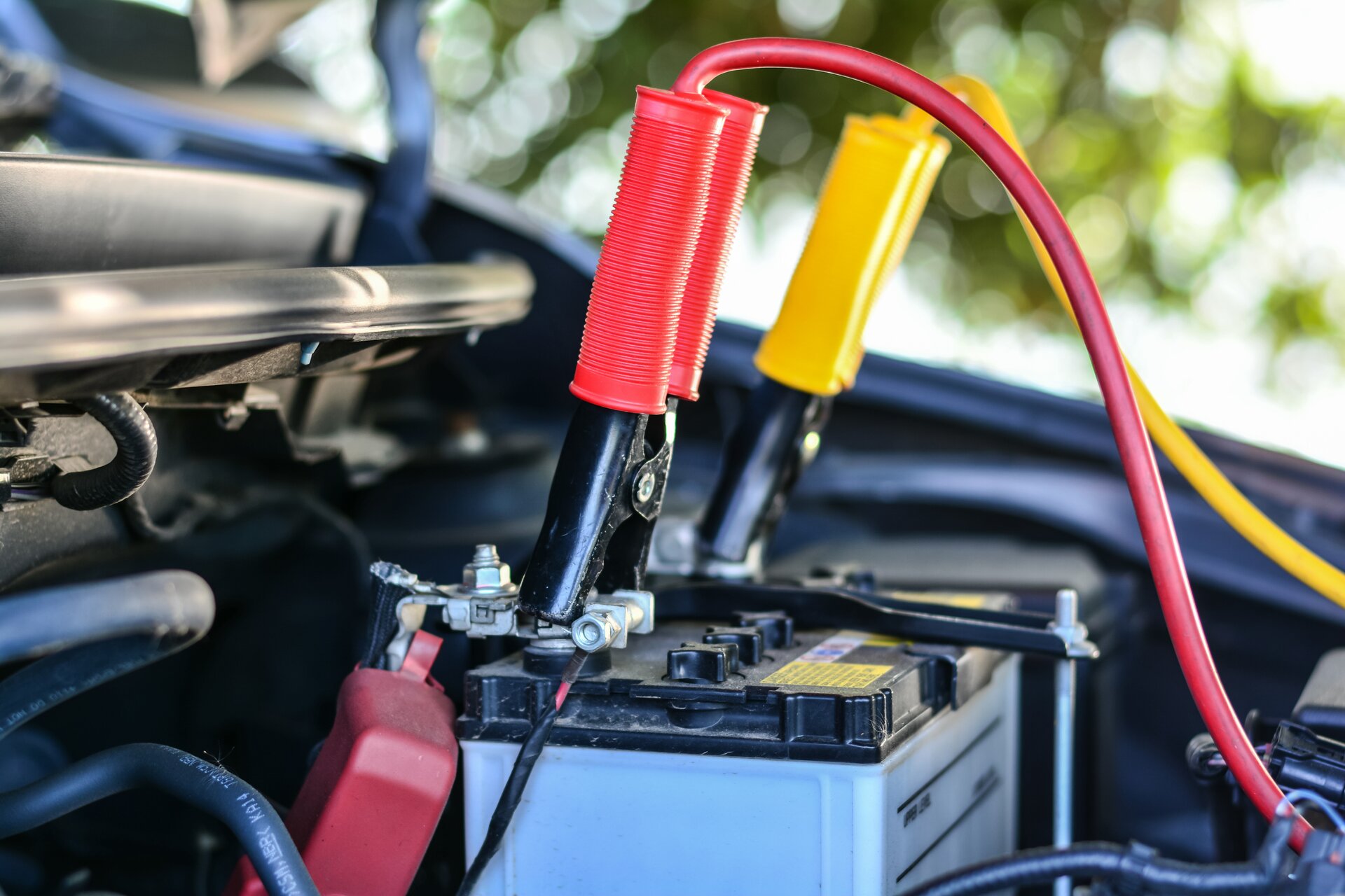 stock-photo-selective-focus-charging-car-with-electricity-trough-cables-422402086
